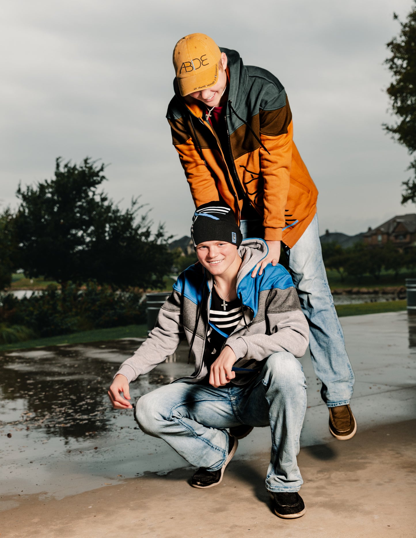 Christian Teen Boys Rough Housing wearing Christian Apparel including Beastly ADONAI Tri-color zip up hoodie, bamboo tees, I AM beanie, and ABIDE hats
