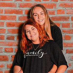 Connection and love: Daughter embraces mother wearing Now Found's Bamboo Family tee.