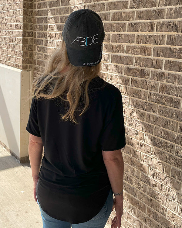 christian woman wearing now found apparels bamboo shirt abide hat
