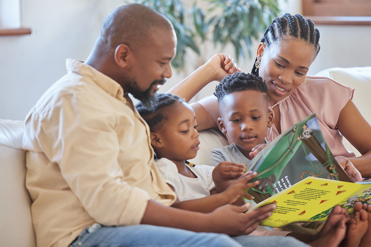 young african american christian family reading "equally treasured" children's book by shelby cohen