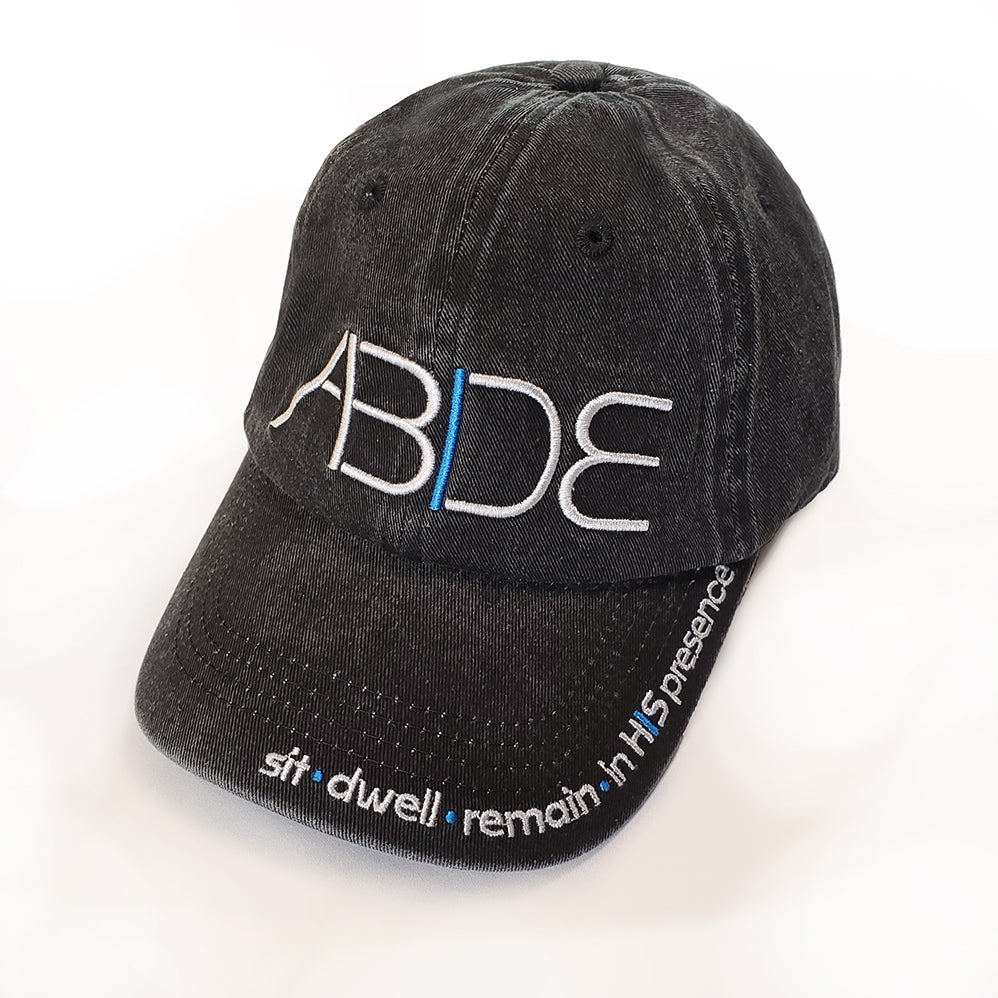 angled shot of ABIDE baseball cap with sit dwell remain in his presence embroidered on bill