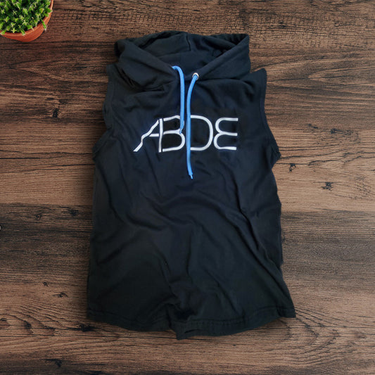 Black sleeveless hoodie with 'ABDE' text on a wooden surface