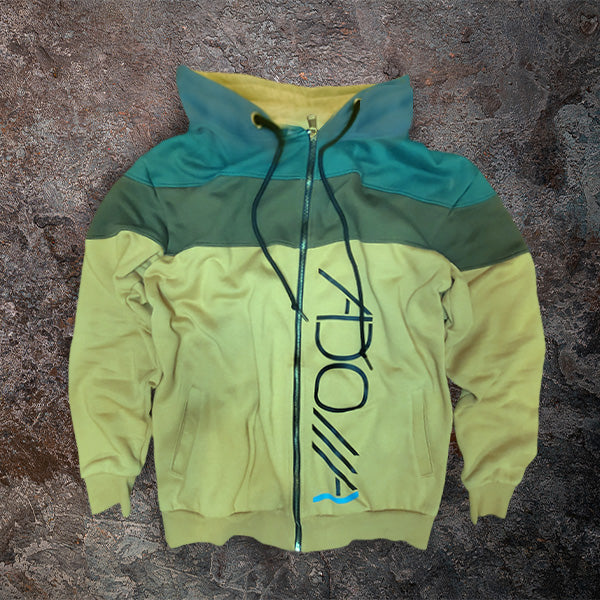 Color-blocked hoodie with ADONAI (Lord) logo on a textured surface
