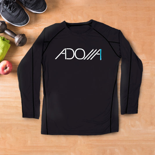 Black long-sleeve fitness shirt with 'ADONAI (Lord)' logo on a wooden surface with gym items.