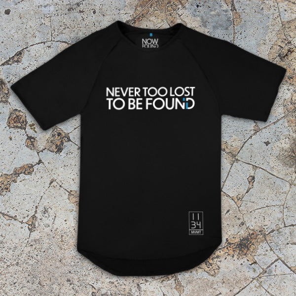 Black Bamboo t-shirt with 'NEVER TOO LOST TO BE FOUND' text on a textured surface