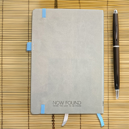 Back of 
Never Too Lost To Be Found Dot Grid Christian Journal on Bamboo with wooden pen