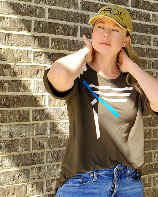 now found apparel founder courtney cohen wearing army green I am bamboo shirt mustard abide dad hat