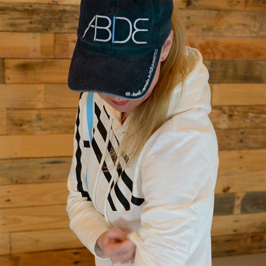 Courtney Cohen wearing now found christian apparel abide dad hat and I am pullover